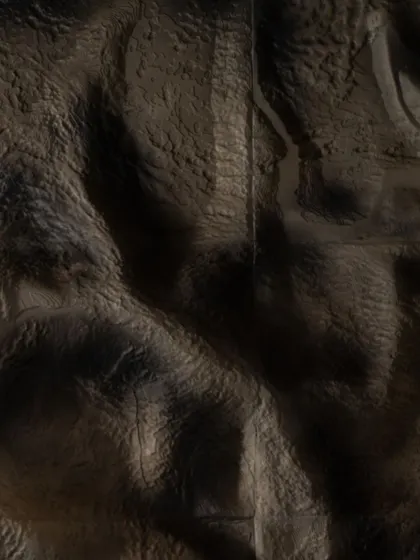 The texture of the mountain wall installation is designed to capture light and shadow, mimicking the dramatic, undulating surfaces of the Himalayas. This detail brings a tangible sense of the natural world into the hotel's interior.