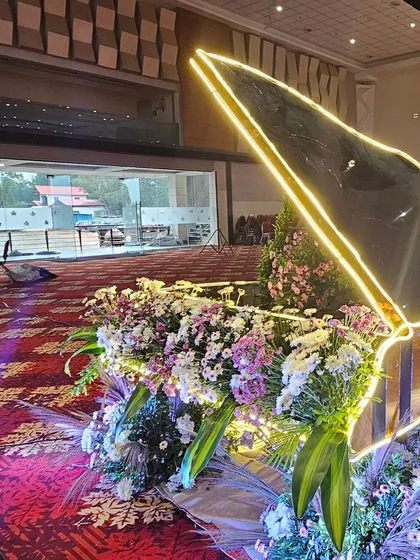 A unique floral piano centerpiece, perfect for a modern reception or sangeet. The prop is filled with beautiful flowers and outlined with LED lights for a magical evening effect.