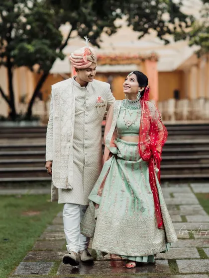 A sweet, candid moment between the couple. The bride's natural-looking makeup is perfect for this daytime event, looking fresh and beautiful.