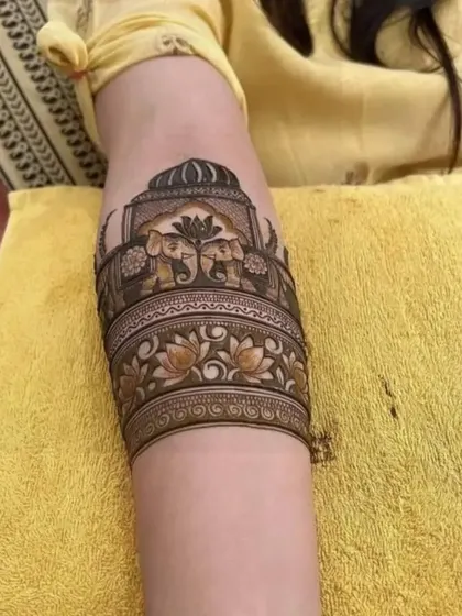 Another view of the popular elephant armband design, showing how it wraps beautifully around the arm. The shading and line work are done with great care.