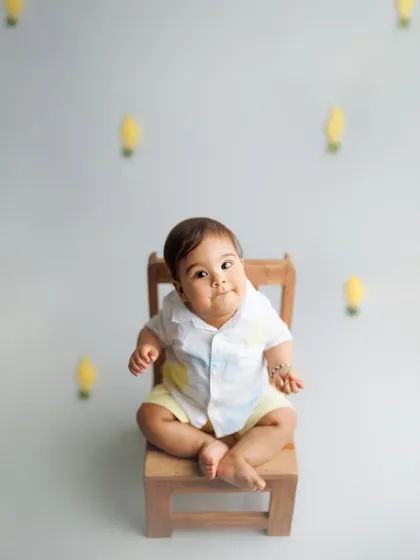 Let me brighten your weekend. This playful shot with a lemon theme is a fun and creative idea for a sitter session or a half-birthday photoshoot.