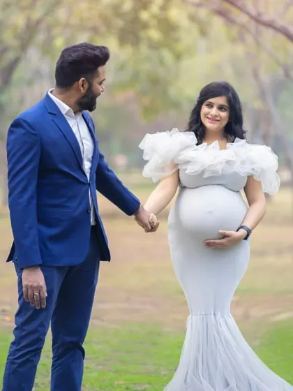 An elegant outdoor maternity portrait for an expecting couple. We chose a beautiful tree-lined path as the backdrop to capture their connection before they become parents.