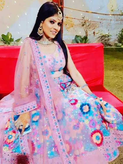 This client is sitting pretty in the colorful floral rental lehenga. It’s a comfortable and eye-catching choice for any celebration.