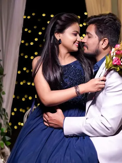 A romantic night setup with fairy lights and flowers. This is perfect for couples who want something dreamy and magical for their pre-wedding shoot.