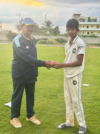 A coach presents a match ball to a promising young player from our U-19 team, recognizing his excellent performance.