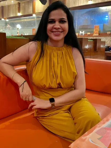 This mustard yellow satin jumpsuit is another one of my birthday outfits. The color is so vibrant and the fabric feels luxurious. It's a perfect statement piece for a special occasion.
