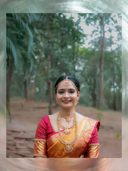 A lovely bridal portrait taken in a natural, wooded setting, highlighting the bride's serene beauty.