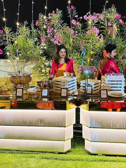 A beautiful buffet setup at my Sahakarnagar banquet hall. The combination of lush greenery and elegant, mirrored counters is perfect for a premium event.