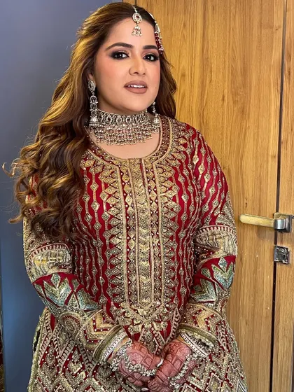 The bride looks elegant and happy, ready for her reception party.