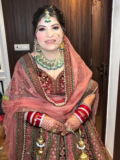 The smile of a bride who feels as good as she looks. The soft glam makeup ensures she looks radiant and confident.