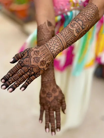 A beautiful bridal design with intricate patterns, shown here in an artistic pose.