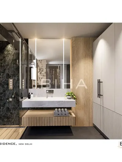 This angle reveals the thoughtful integration of storage and lighting. A full-height, minimalist white wardrobe provides ample storage, while vertical light strips framing the mirror offer perfect, shadow-free illumination for the vanity area.