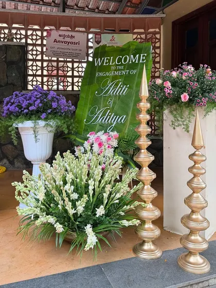A unique welcome sign for an engagement, written on a large banana leaf. It's a creative and eco-friendly touch that guests love.