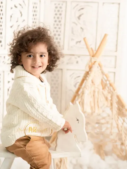 A classic toddler portrait with a rocking horse and a boho teepee. I have a wide range of props available in the studio to create fun and engaging sessions for kids.