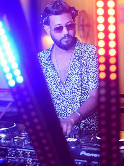 A close-up shot while mixing, with the club lights adding to the atmosphere.