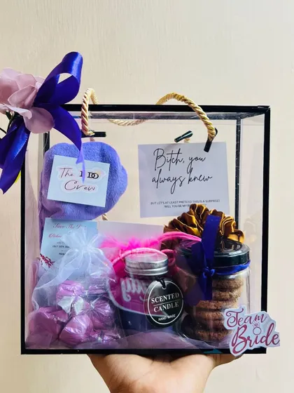 Another look at the hand-held bridesmaid hamper, showing how the items are neatly arranged to be visible through the clear box.