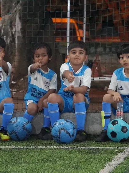 Our youngest players sitting together, a picture of budding friendships and team spirit.