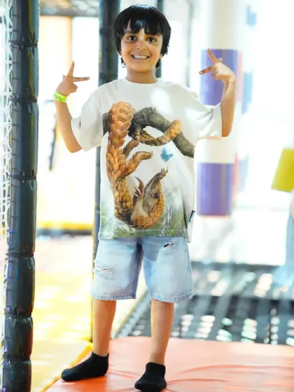 This young man is showing off his cool moves and having a great time.