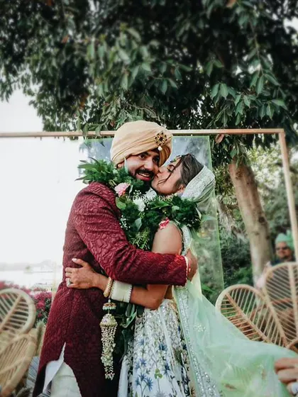The jaimala is more than a ritual; it's a moment of pure joy. We love creating the perfect backdrop for these memories, where the couple's happiness is the true centerpiece of our design. This candid moment captures the love and laughter that we strive to inspire.