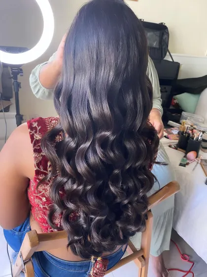 The finished look: beautiful, healthy-looking waves with a simple half-up twist, created without crimping for a soft finish.