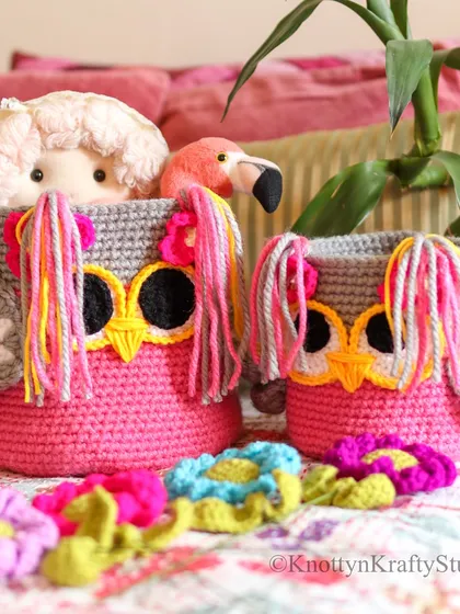 How much pink is too much pink? My answer is, never enough. Here are two of my Owlie Baskets, filled with toys and surrounded by colourful crochet flowers.