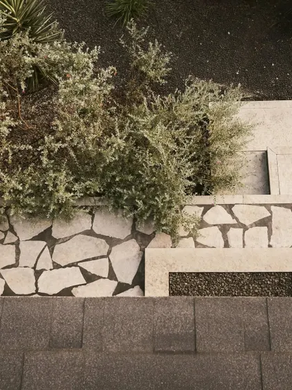 The flagstone paving at Pavilion House, where we mixed different sizes and shapes of stone to create a textured, organic pattern. This detail extends from the outdoor patio into the landscape, blurring the lines between the built and natural environments.