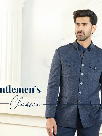 Gentleman's Classic. The navy blue co-ord set, featuring a structured jacket with shoulder epaulets and chest pockets, is a harmonious blend of elegance and refinement.