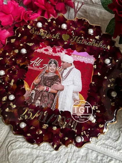 The rich burgundy color of the petals makes this a striking piece of decor. It's a perfect way to remember a special day, ideal for an anniversary gift.