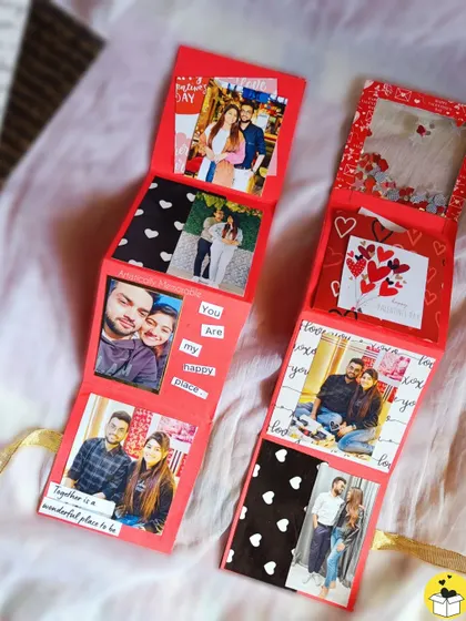 A look at a red zig-zag or accordion-style mini album, which unfolds to reveal a story.