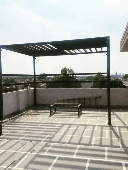 A full view of the simple and elegant black MS pergola.