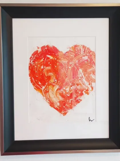 The framed red textured heart, a symbol of passion and love. This piece, with its vibrant color and simple frame, can be a stunning focal point in a living room or bedroom.