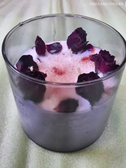 Elegance in every flame. This beautiful glass jar candle is infused with dried rosebuds, bringing a sense of calm, charm, and self-love to any corner of your home.