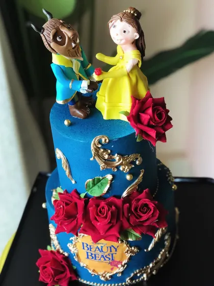 A tale as old as time, sweet as this cake. We bring fairytales to life with this Beauty and the Beast cake, featuring handcrafted figures and deep red sugar roses.