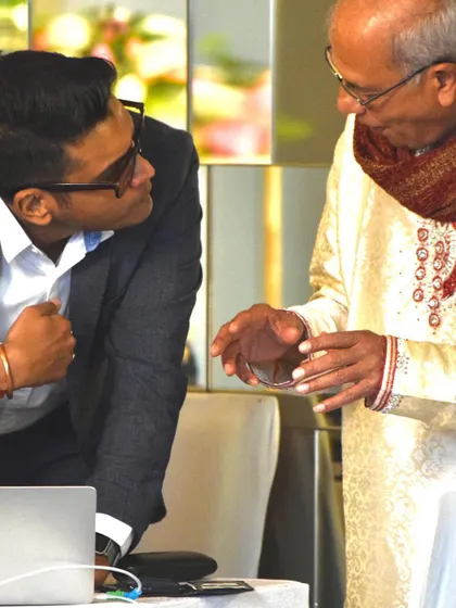 Taking a moment to chat with a guest about a song request. I believe in being approachable and interactive, ensuring the music reflects the tastes of the couple and their loved ones.