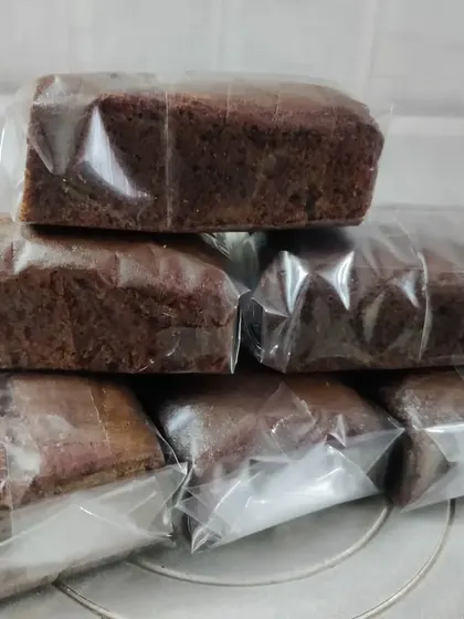 A stack of my chocolate loaf cakes, all sliced and wrapped. They are perfect for when you need a simple, delicious, and shareable dessert.
