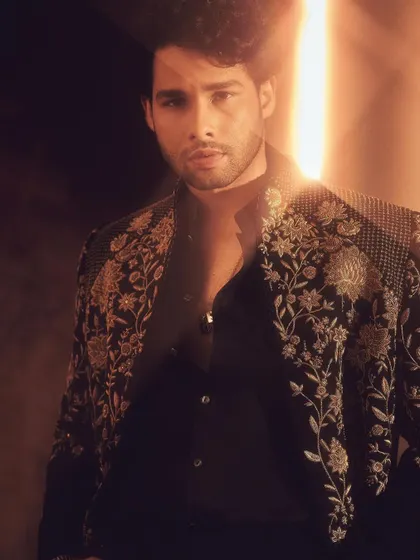 This close-up portrait of Siddhant shows the exquisite detail of the Tarun Tahiliani piece. It’s a masterclass in modern Indian craftsmanship.