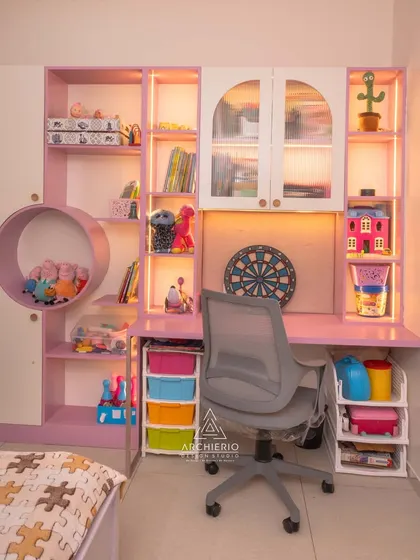 The study area in this kids' room is designed for creativity, with open shelves for toys, a dartboard, and colorful storage bins.