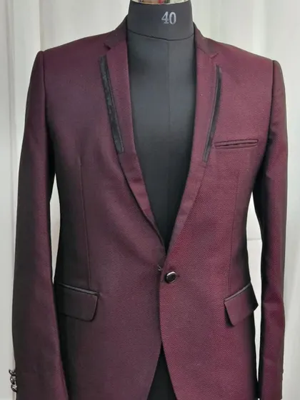 This classic maroon blazer with black lapel details is a sharp and stylish rental choice for any event.