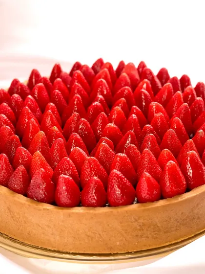 A tart worth a thousand words. This larger-than-life Chocolate Pudding Tart with fresh strawberries was the heart of a love story, made for a client's engagement.