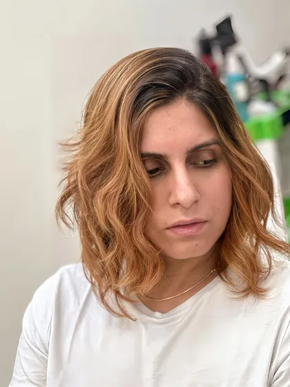 Pure 24k Gold Copper hair. This look combines a vibrant copper color with a messy, beach-wave haircut for an effortlessly cool style.