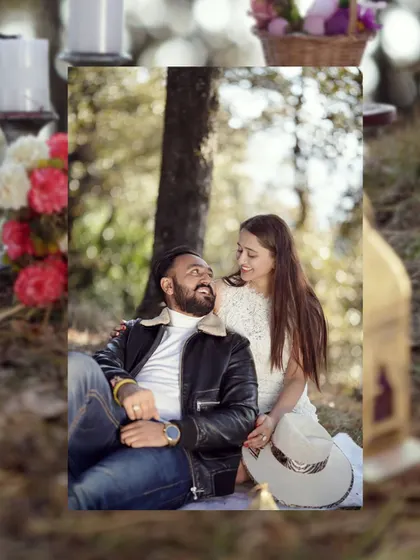 A sweet, candid moment from a picnic-themed pre-wedding shoot. The couple is relaxed and smiling, showing the comfortable and natural vibe I aim for.