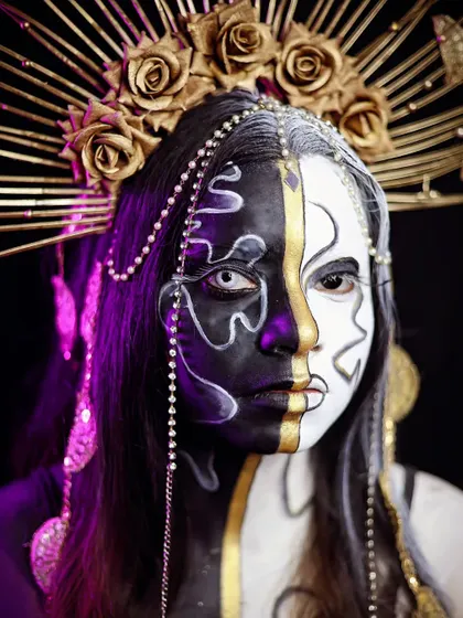 A direct portrait that highlights the duality and artistry of the black and white design.