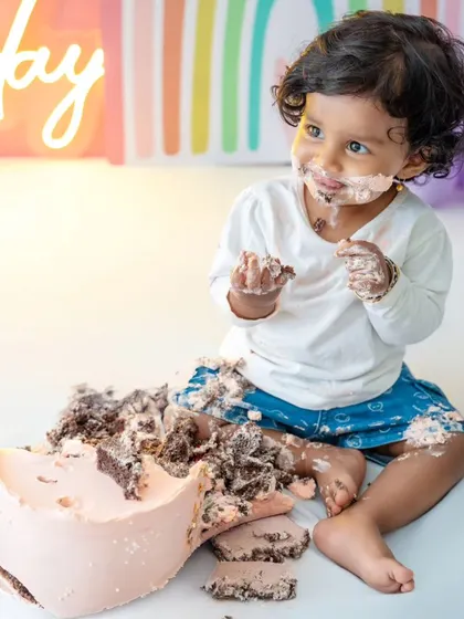 The final result of a very enthusiastic cake smash! These are the fun, real moments that I love to capture.