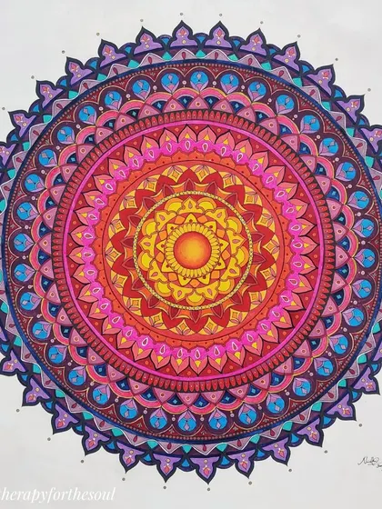 A custom hand-painted mandala on canvas with a fiery sun at its center, radiating outwards into cooler pink and purple tones.