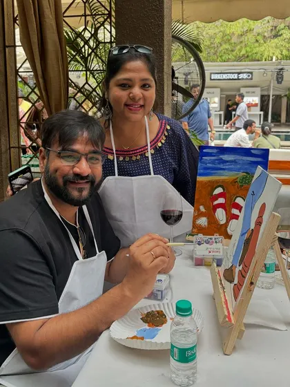 A happy couple painting at the Birkenstock event. Our workshops are a great addition to any large-scale event, offering a fun and interactive experience for guests.