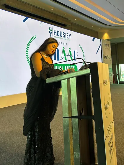 At the podium for the Housiey Annual Meet. The stage is where I feel most at home, and I share that love and energy with every audience.