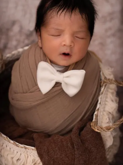 Little stardust blown from the hands of God. This simple and elegant setup with a dapper bow tie is perfect for a quick and classic mini session.
