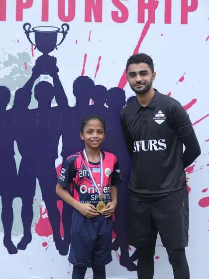 One of our youngest top performers receiving her medal at the Hasan Memorial Championship. Her skill and determination were on full display.