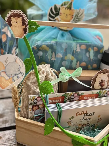 A closer look at the jungle hamper, showing the personalized water bottle, notecards, and other themed items I curated for the gift.