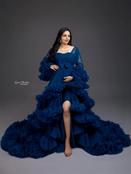 The bow detail on this royal blue gown adds a touch of sweetness to a very glamorous and powerful look. It’s a beautiful combination of strength and femininity.